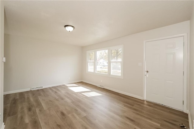 unfurnished room featuring dark hardwood / wood-style floors