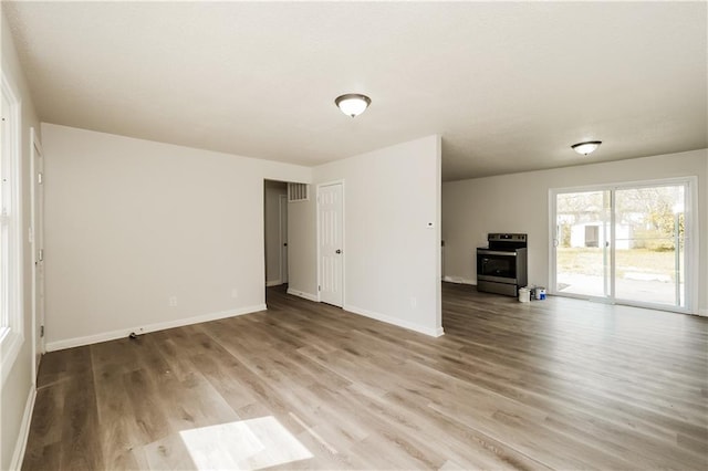 unfurnished living room featuring hardwood / wood-style floors