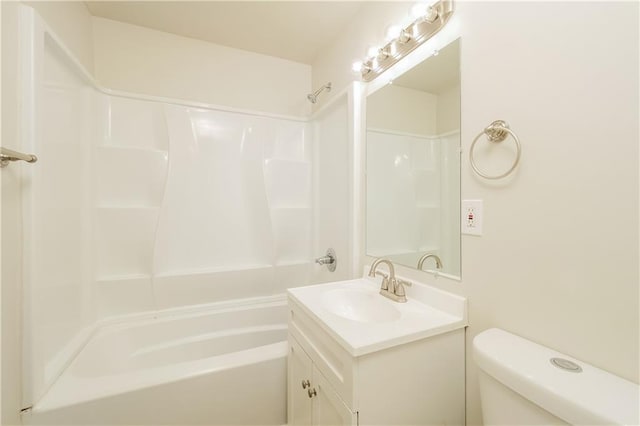 full bathroom featuring vanity with extensive cabinet space, toilet, and shower / bathing tub combination