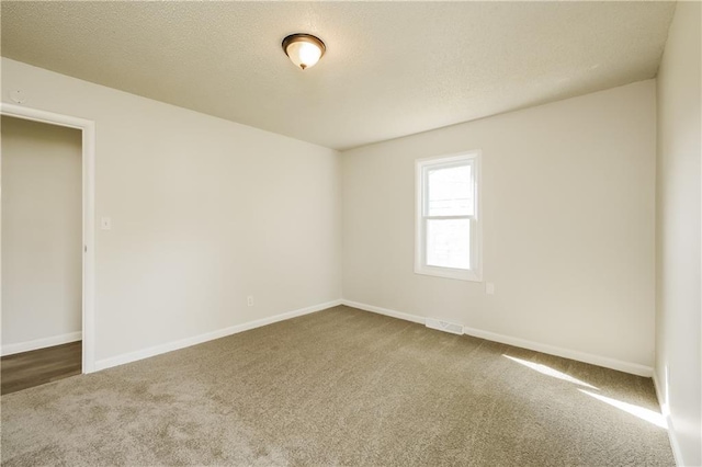 unfurnished room with carpet