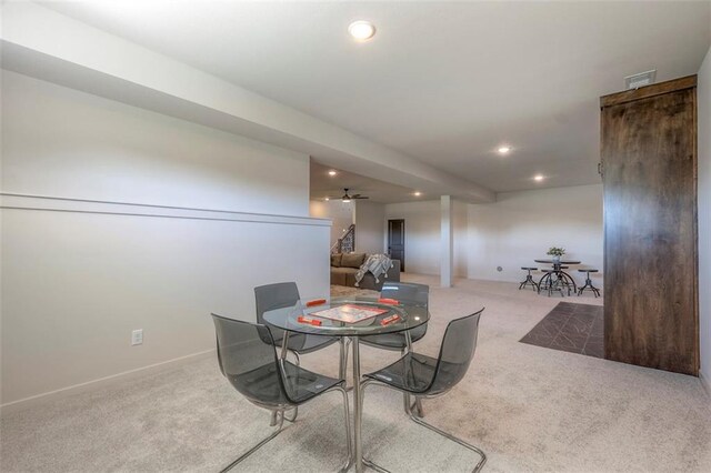 dining room with light carpet