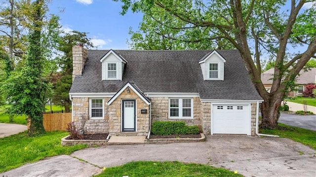 cape cod house with a garage