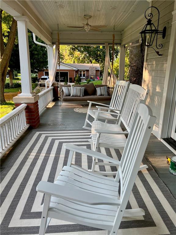 view of patio featuring ceiling fan and a porch