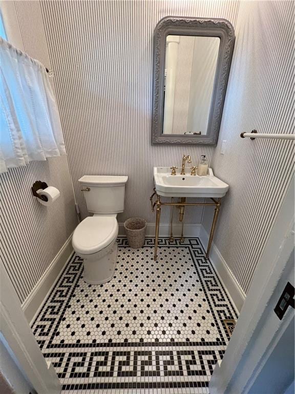 bathroom featuring sink and toilet