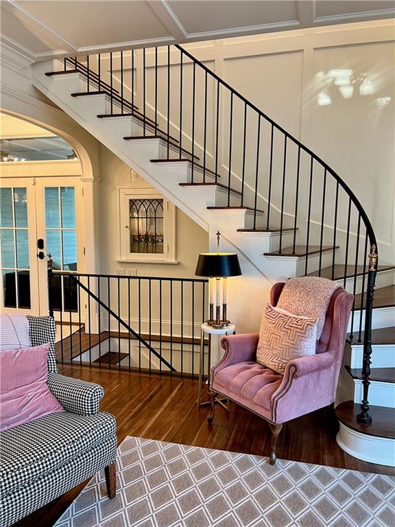 sitting room with hardwood / wood-style floors and french doors