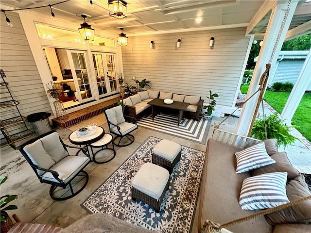 view of patio / terrace featuring french doors, ceiling fan, and an outdoor living space