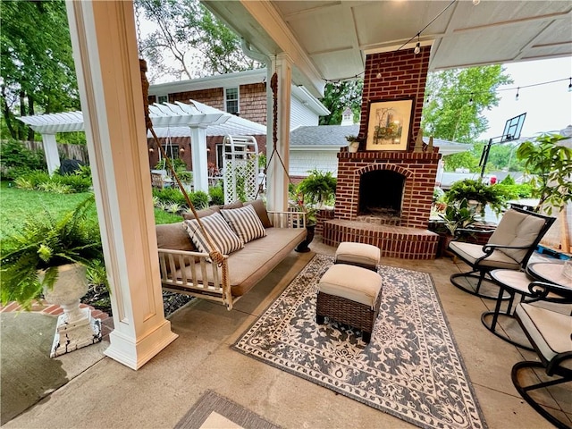 view of patio / terrace with a pergola and an outdoor brick fireplace