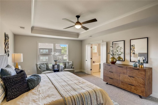 bedroom featuring ceiling fan, light colored carpet, visible vents, baseboards, and a raised ceiling