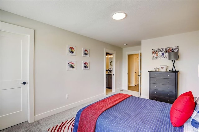 bedroom featuring carpet and baseboards