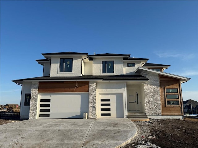 prairie-style home featuring a garage