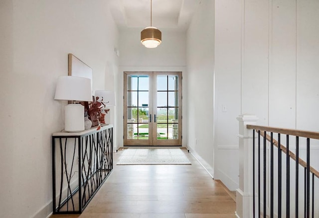 doorway to outside with french doors and light wood-type flooring