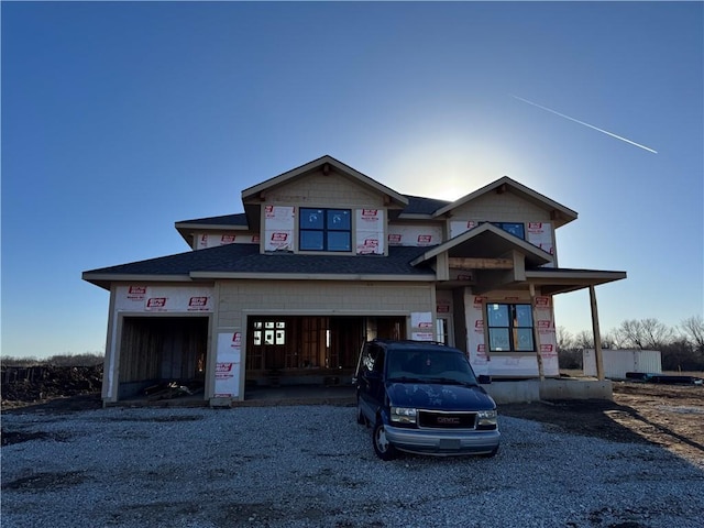 property in mid-construction with a garage