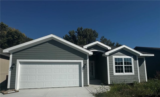 single story home featuring a garage