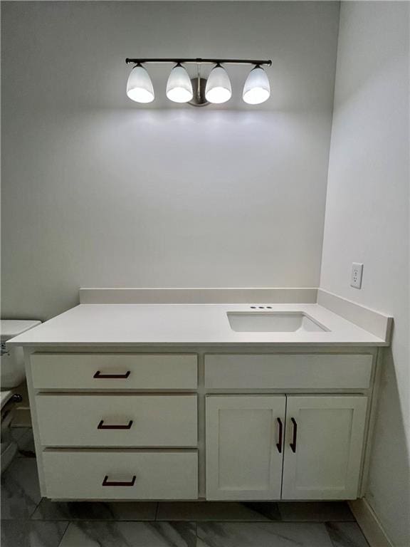 bathroom with vanity and toilet