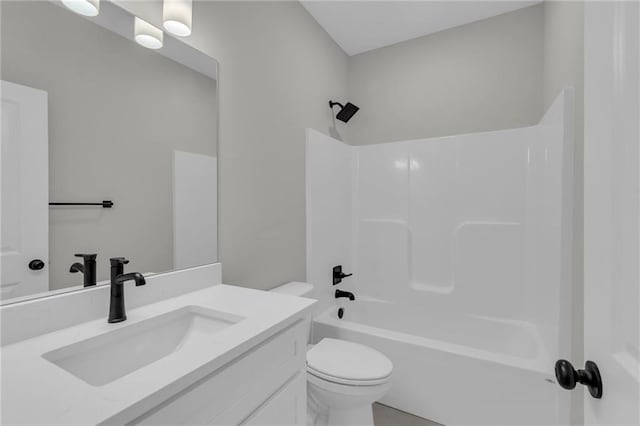 full bathroom featuring toilet, bathing tub / shower combination, and vanity