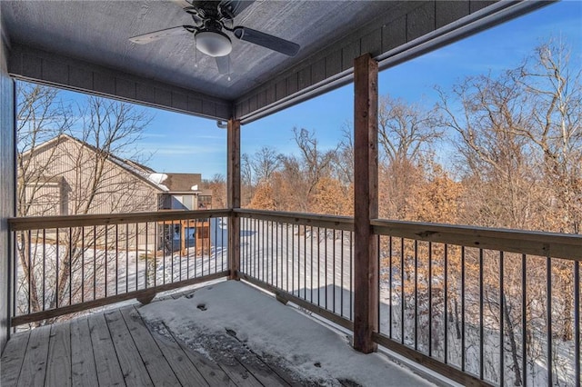 wooden terrace featuring ceiling fan