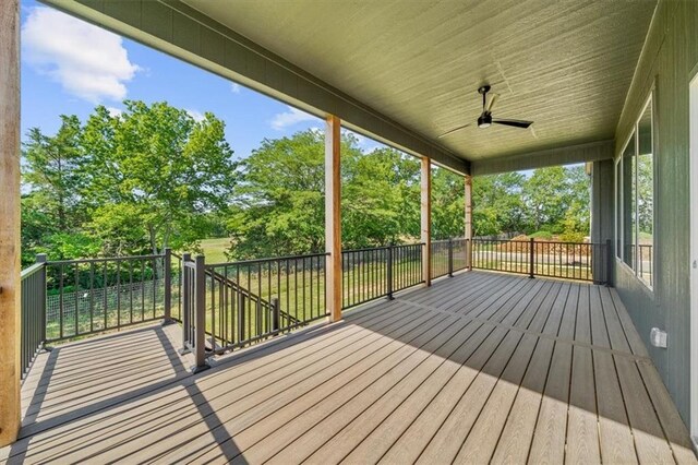 wooden deck featuring ceiling fan