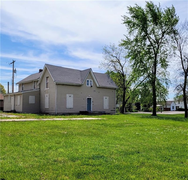 view of home's exterior with a lawn