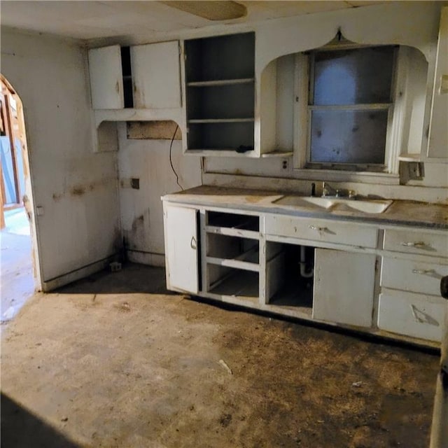 kitchen with white cabinetry and sink