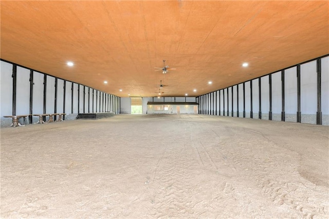 interior space with ceiling fan