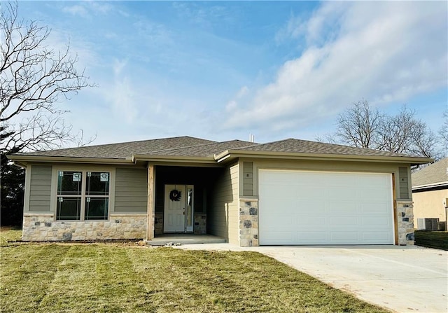 prairie-style house with a front lawn and a garage