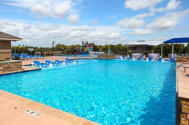 view of swimming pool featuring pool water feature