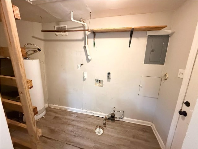 laundry room with electric panel, hardwood / wood-style flooring, gas water heater, and washer hookup