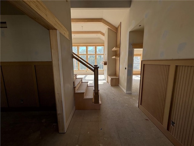 hallway with vaulted ceiling