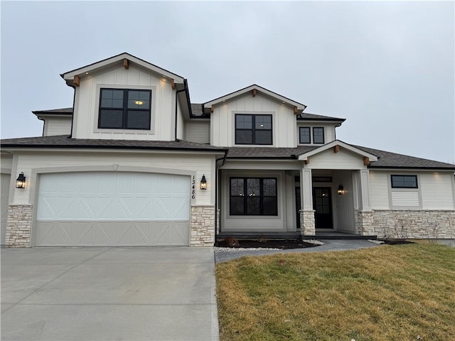 view of front of home featuring a garage and a front yard