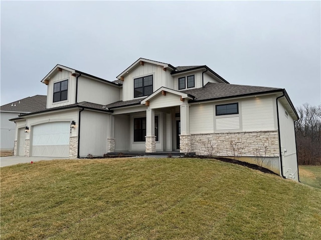 view of front of house with a garage and a front yard