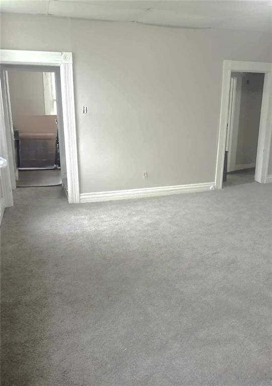 empty room with carpet flooring