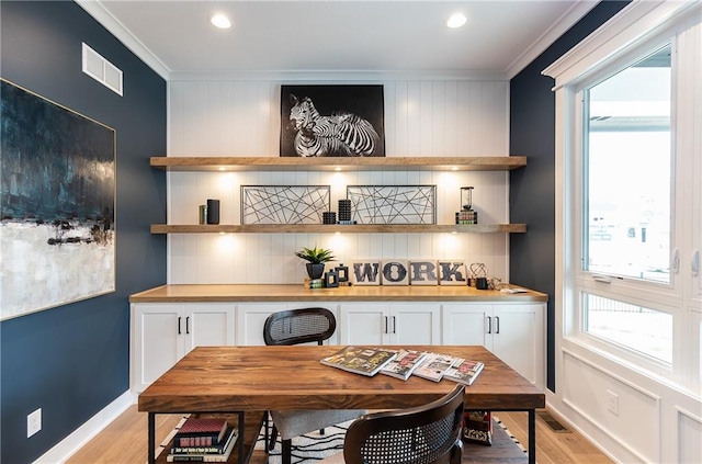 bar with crown molding, white cabinets, backsplash, and light hardwood / wood-style floors