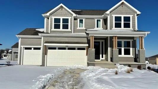 view of front of house with a garage and a porch