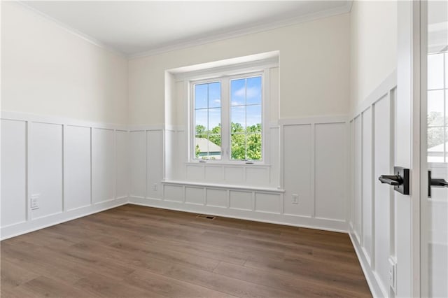 unfurnished room with dark hardwood / wood-style flooring and crown molding