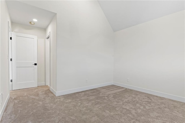 unfurnished room featuring carpet