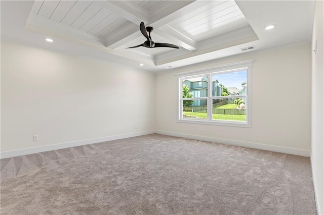 carpeted spare room featuring beamed ceiling, ceiling fan, a tray ceiling, and coffered ceiling