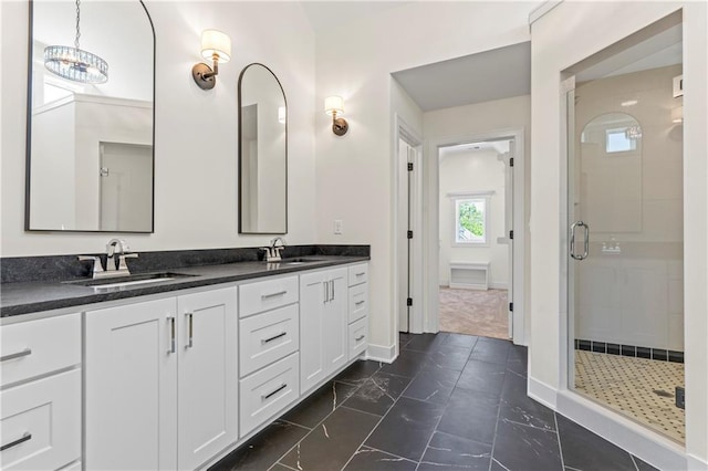 bathroom featuring walk in shower, tile floors, and dual bowl vanity