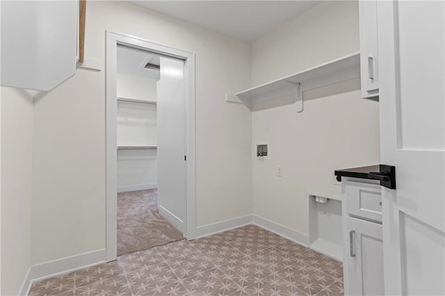 laundry area with light tile floors and hookup for a washing machine