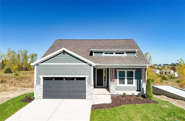 craftsman house with a garage and a porch