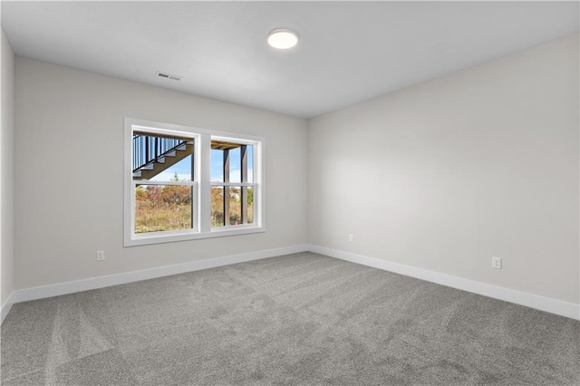 unfurnished room with carpet floors