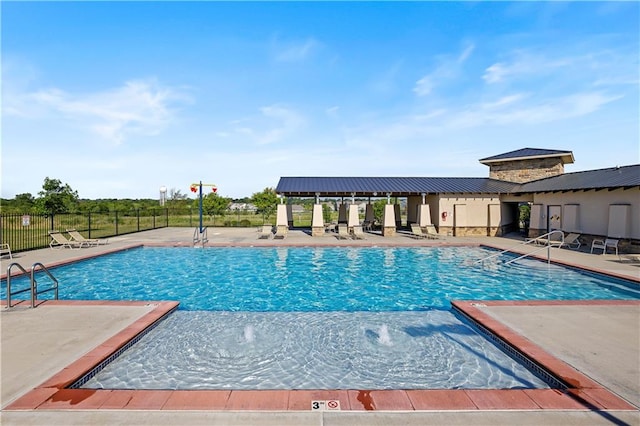 view of pool featuring a patio area and pool water feature