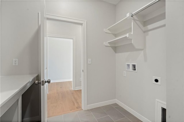 laundry area featuring washer hookup, electric dryer hookup, and hardwood / wood-style floors