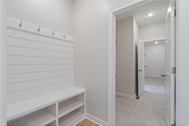 mudroom with light tile patterned floors