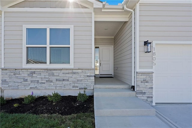 property entrance featuring a garage