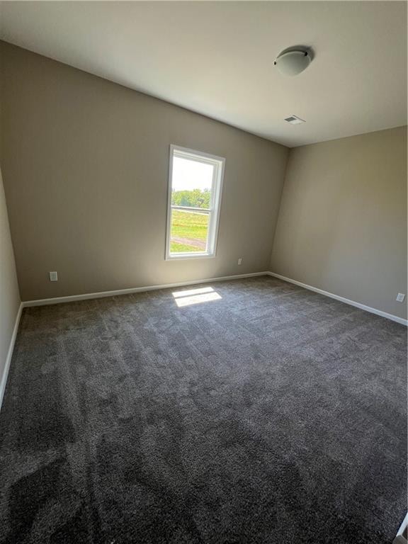 unfurnished room featuring carpet flooring