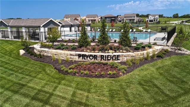 surrounding community with a pool and a lawn