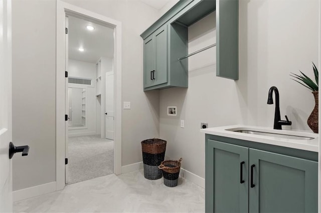 1717 SW Arbormill Ter, Lees Summit, MO 64082 - laundry area with hookup for an electric dryer, hookup for a washing machine, cabinet space, and baseboards