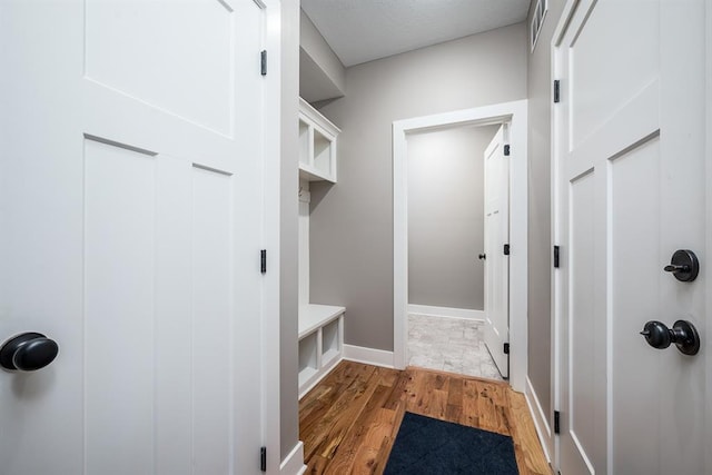 mudroom featuring wood-type flooring