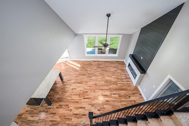 living room featuring hardwood / wood-style floors and ceiling fan