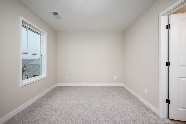 empty room featuring carpet flooring